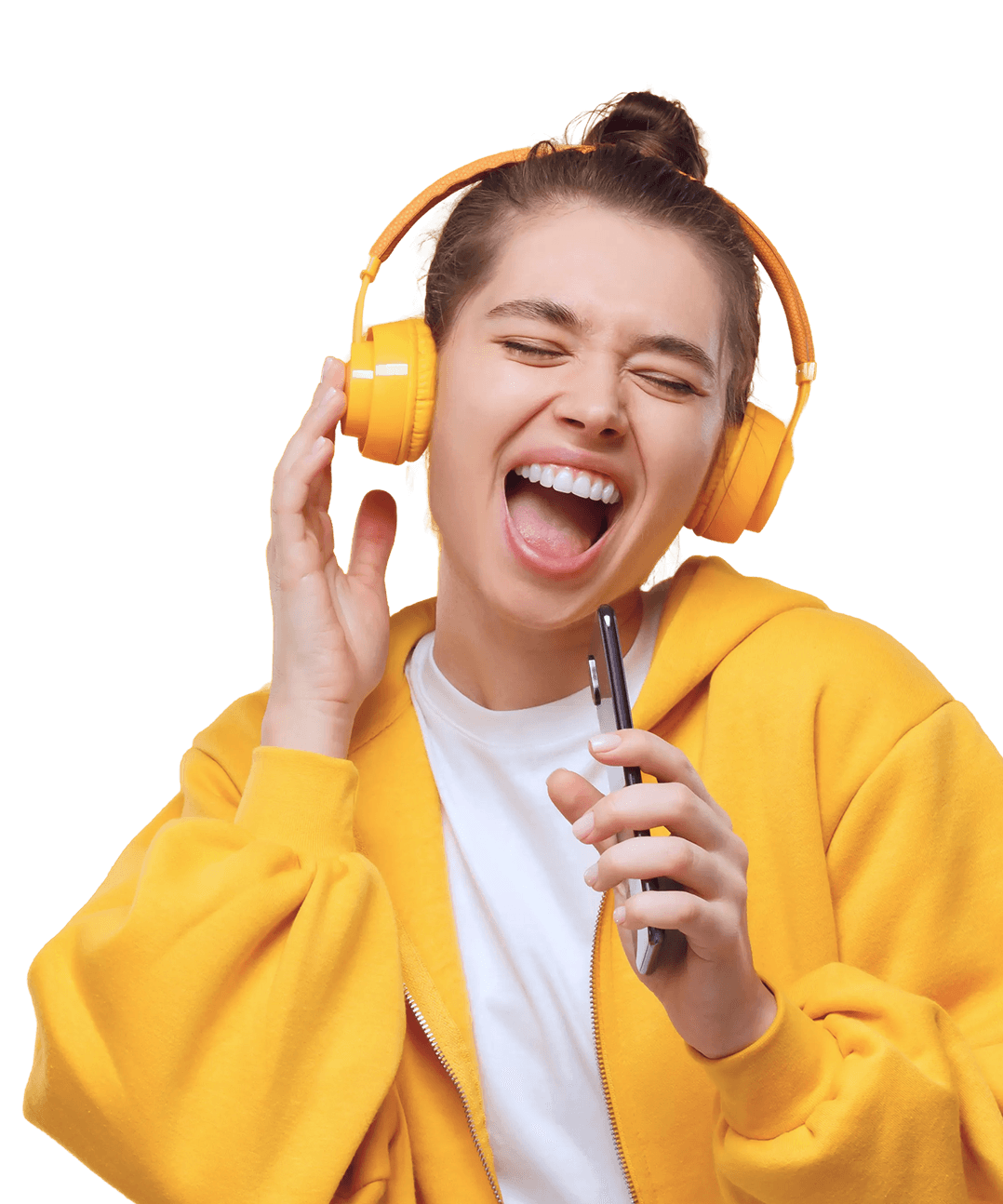 Singer wearing yellow headphones performing into her phone
